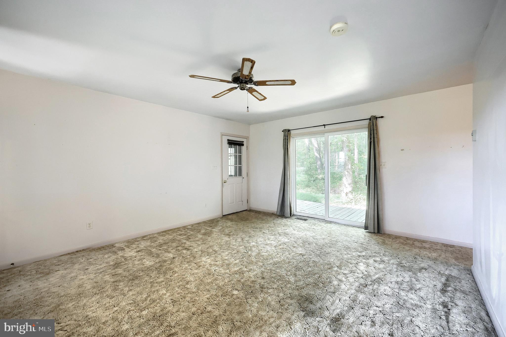 1059 Main St Extension Felton, PA 17322 - Photo 26 of 63 a view of a livingroom with a ceiling fan and window
