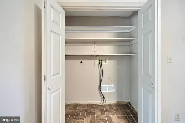 a bathroom with a tub sink shower and mirror