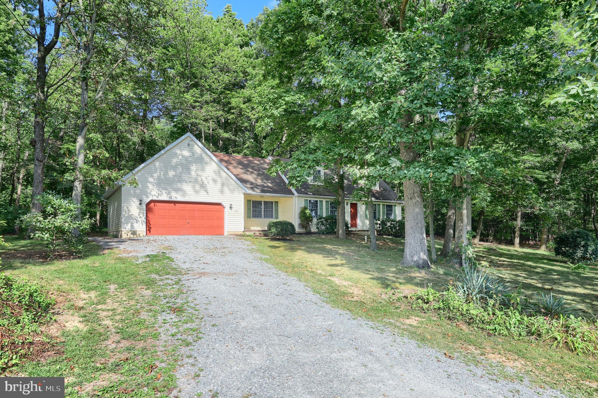 1059 Main St Extension Felton, PA 17322 - Photo 3 of 63 a front view of a house with a yard garage and outdoor seating