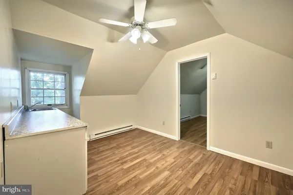 a stove top oven sitting next to a window
