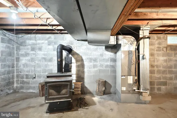 a picture of a room with a white wall and white cabinet