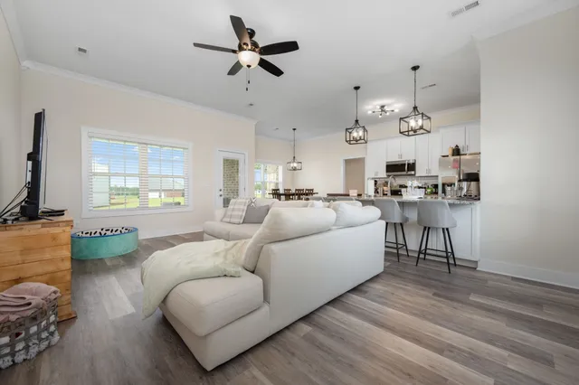 a living room with furniture and a window