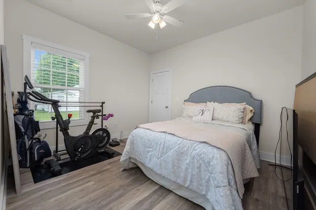 an aerial view of a house with a garden and swimming pool