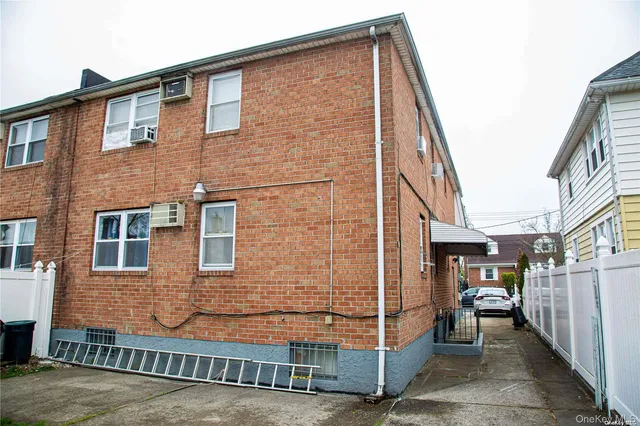 a brick house with a large windows