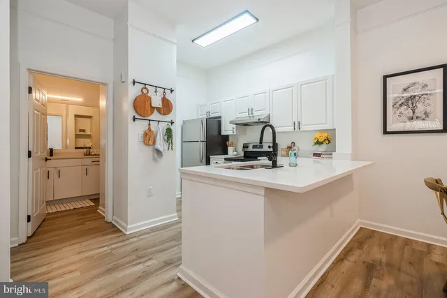 a view of kitchen with wooden floor