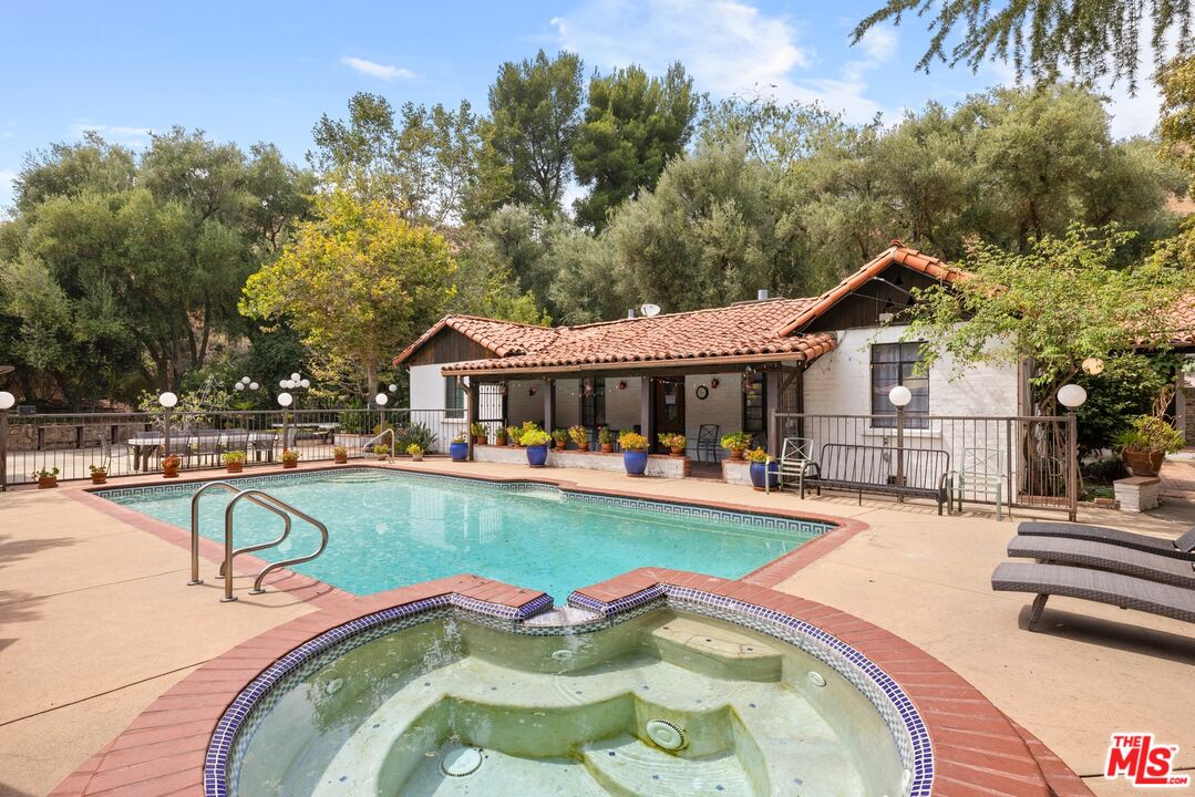 9145 La Tuna Canyon Road Sun Valley, CA 91352 - Photo 1 of 16 swimming pool view with a seating space and a garden view
