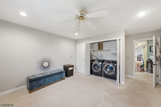 a very nice looking room with a bed and a chandelier
