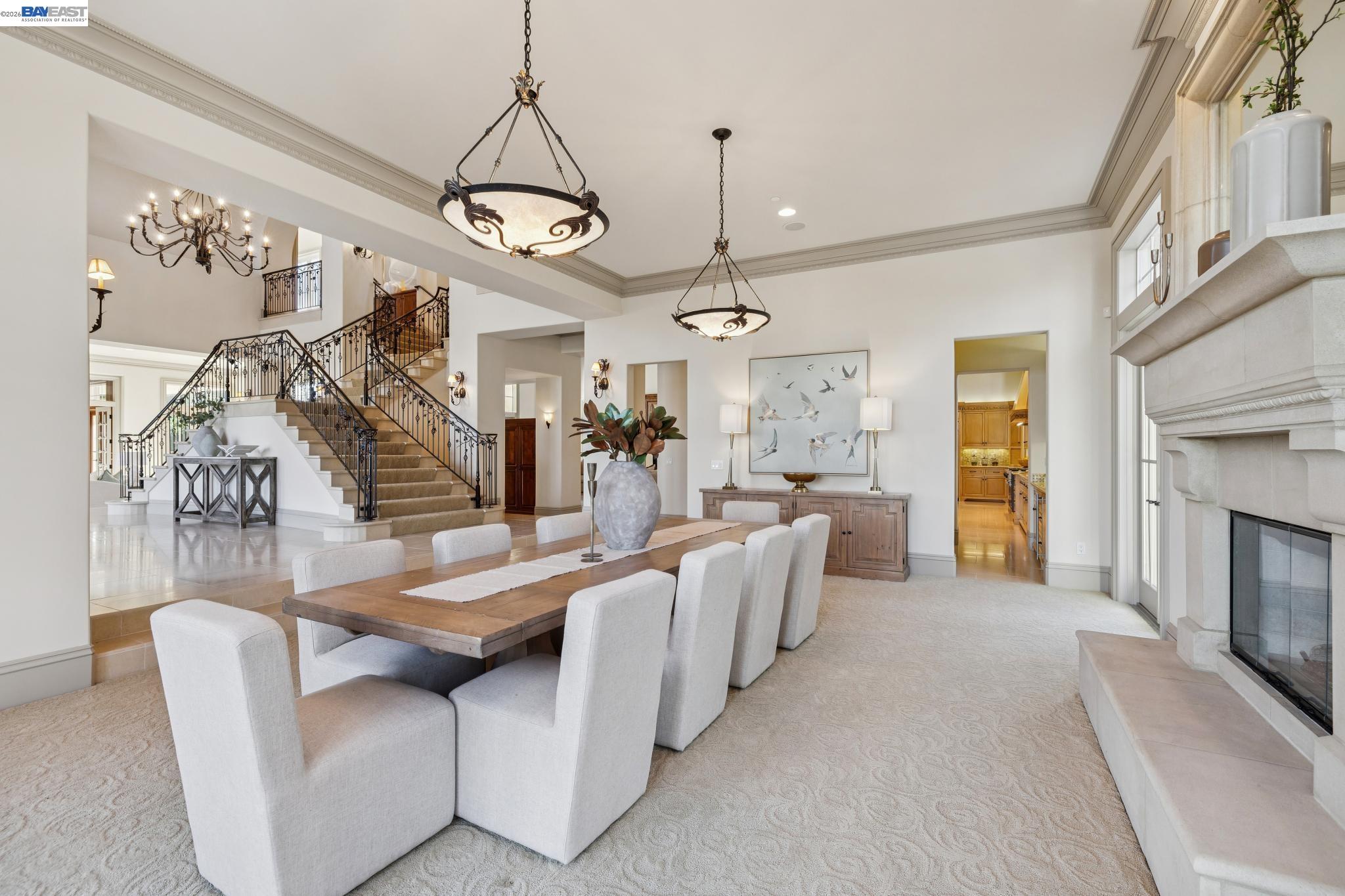 1398 Piemonte Drive Pleasanton, CA 94566 - Photo 16 of 60 a living room with furniture a fireplace and a chandelier