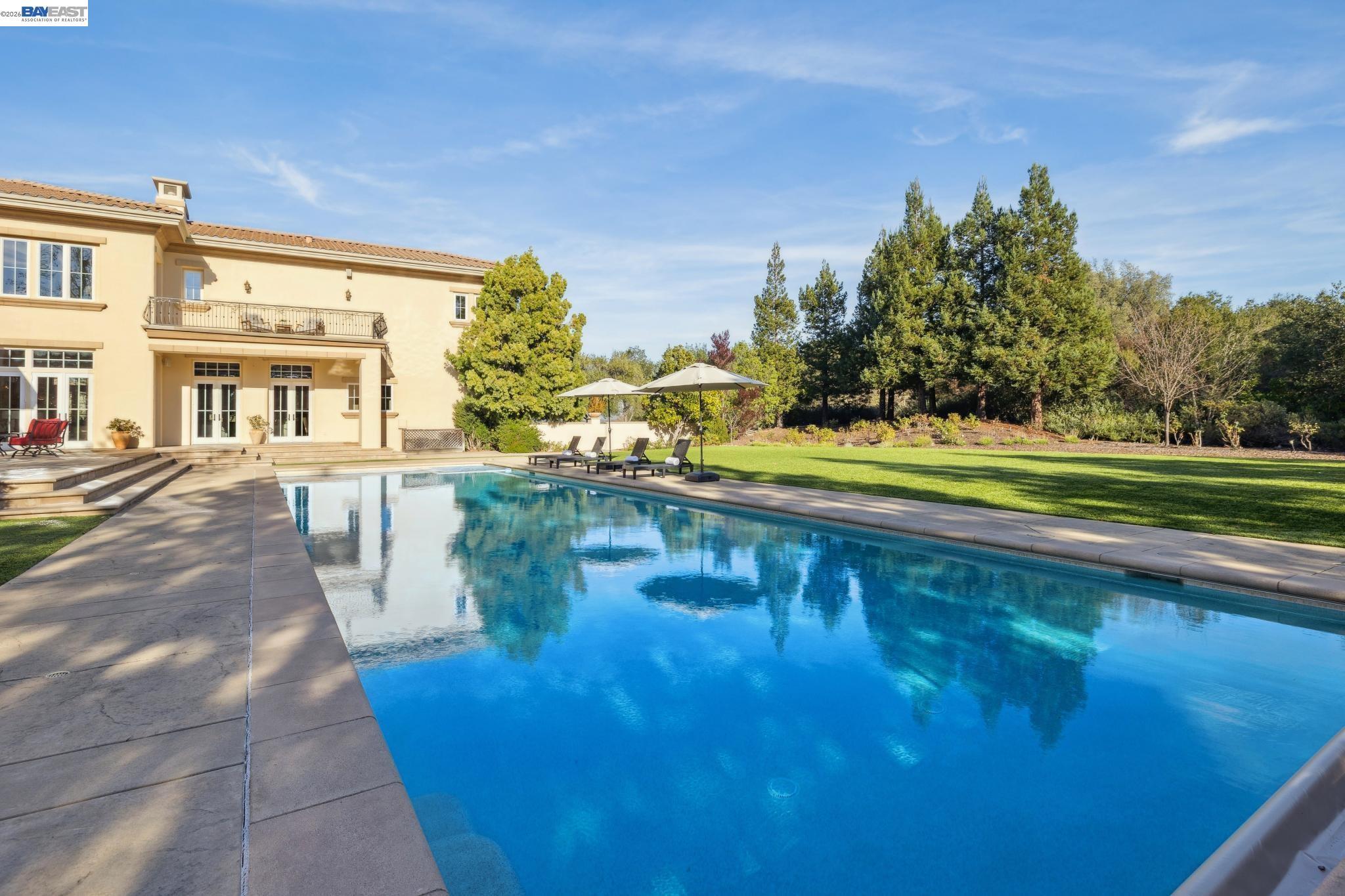 1398 Piemonte Drive Pleasanton, CA 94566 - Photo 17 of 60 a view of a swimming pool with an outdoor seating