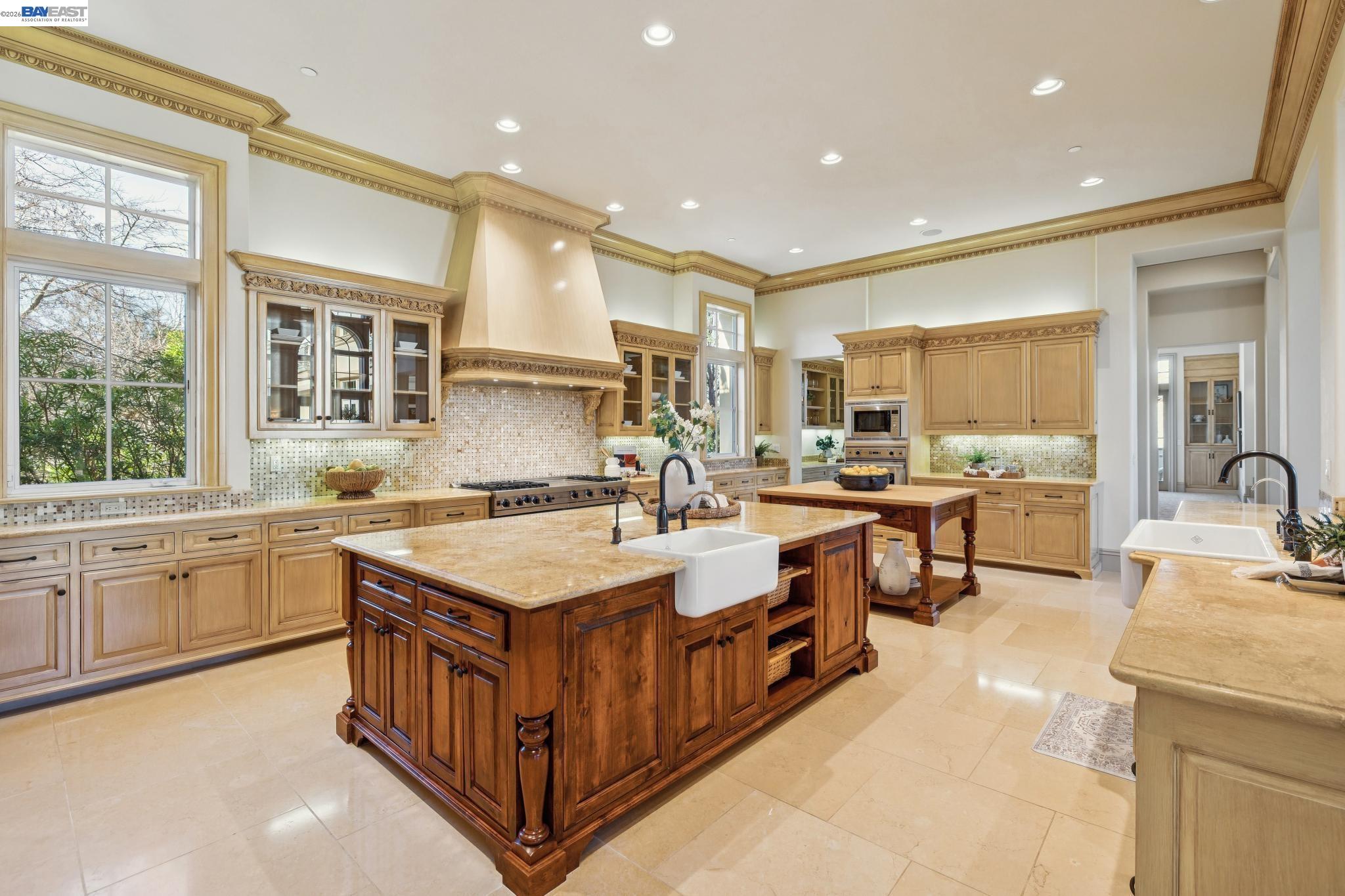 1398 Piemonte Drive Pleasanton, CA 94566 - Photo 20 of 60 a large white kitchen with a stove top oven and sink