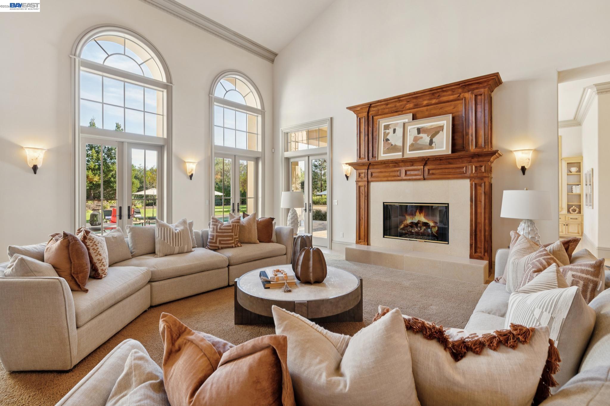 1398 Piemonte Drive Pleasanton, CA 94566 - Photo 25 of 60 a living room with furniture a fireplace and a large window