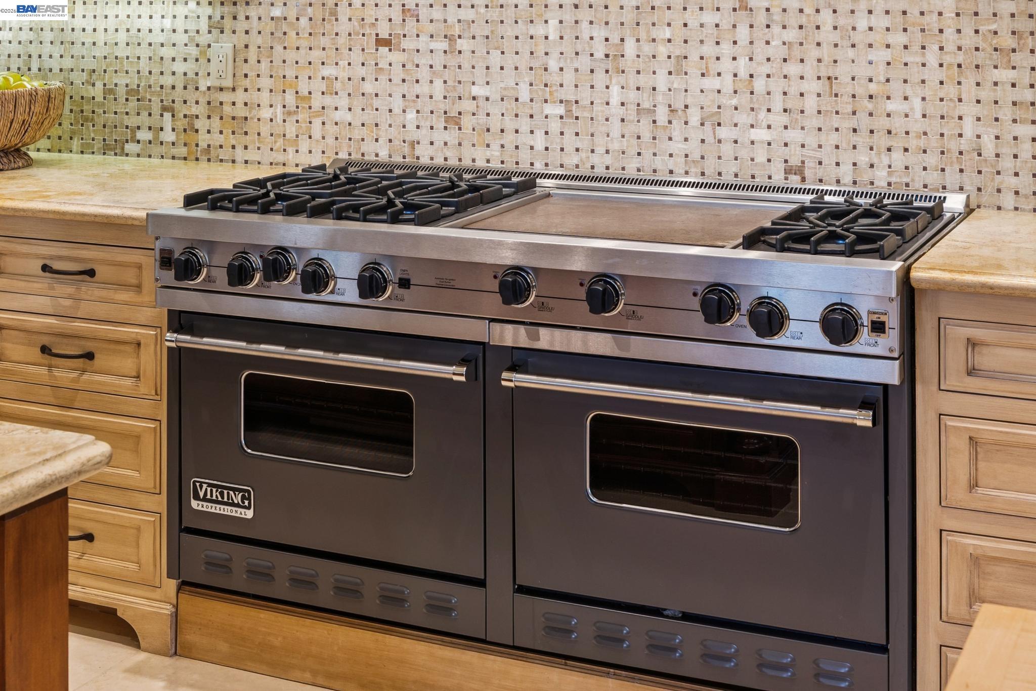 1398 Piemonte Drive Pleasanton, CA 94566 - Photo 25 of 60 a stove top oven sitting inside of a kitchen