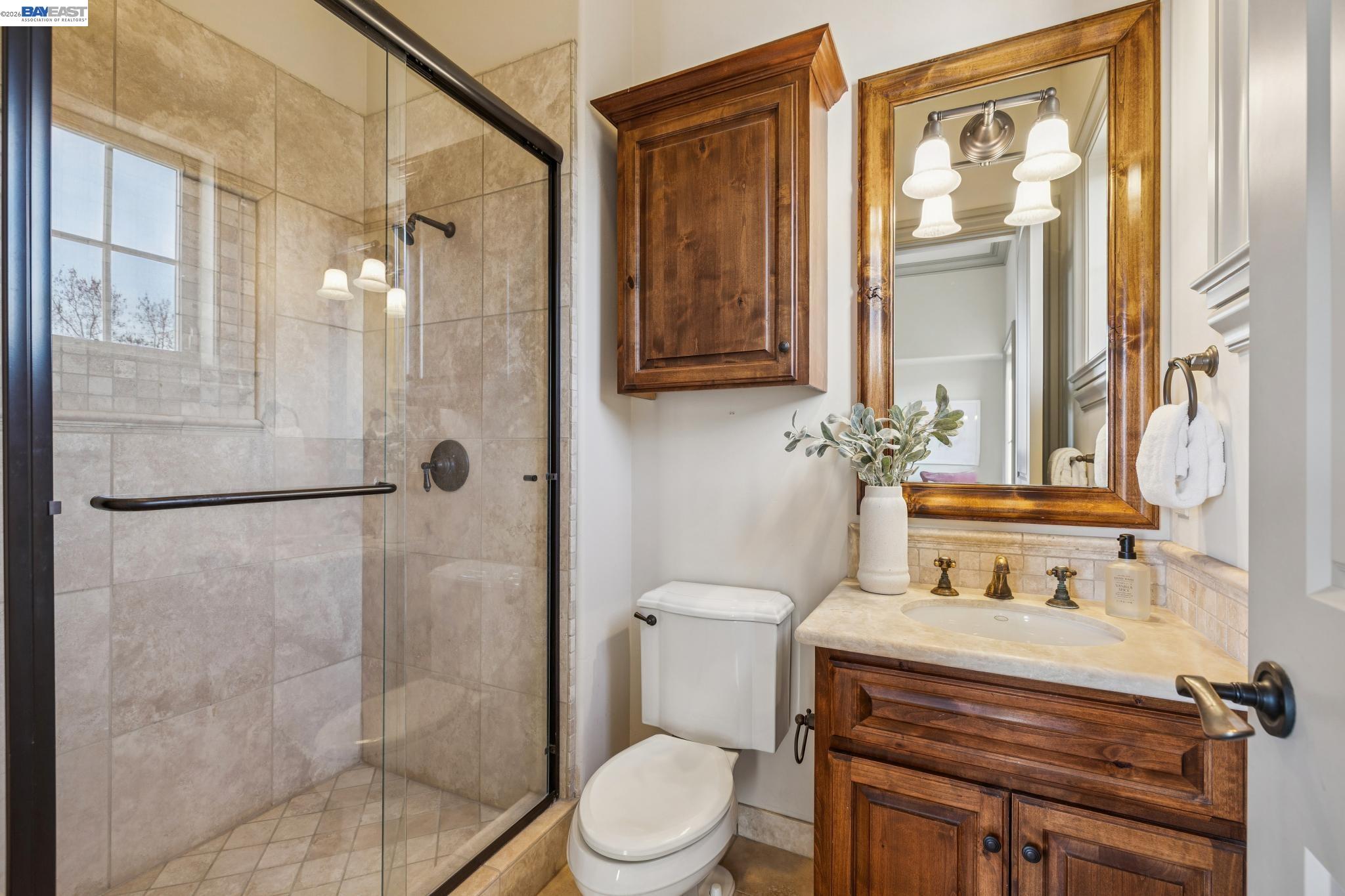 1398 Piemonte Drive Pleasanton, CA 94566 - Photo 38 of 60 a bathroom with a sink toilet and shower