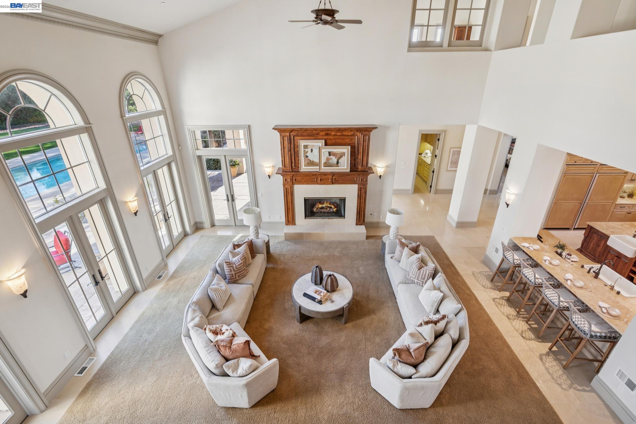 1398 Piemonte Drive Pleasanton, CA 94566 - Photo 49 of 60 a living room with furniture and floor to ceiling windows
