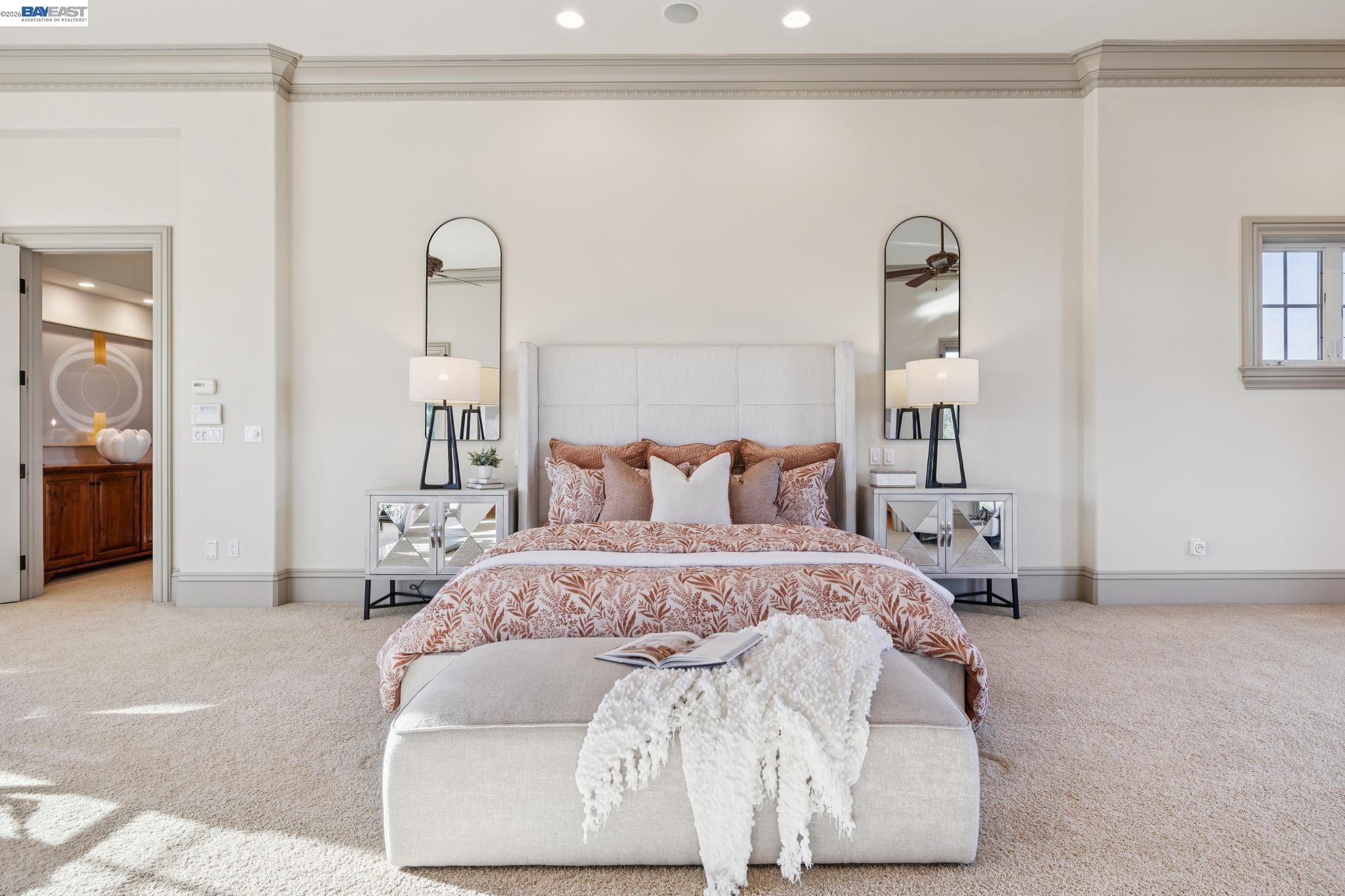 1398 Piemonte Drive Pleasanton, CA 94566 - Photo 51 of 60 a spacious bedroom with a bed and a mirror