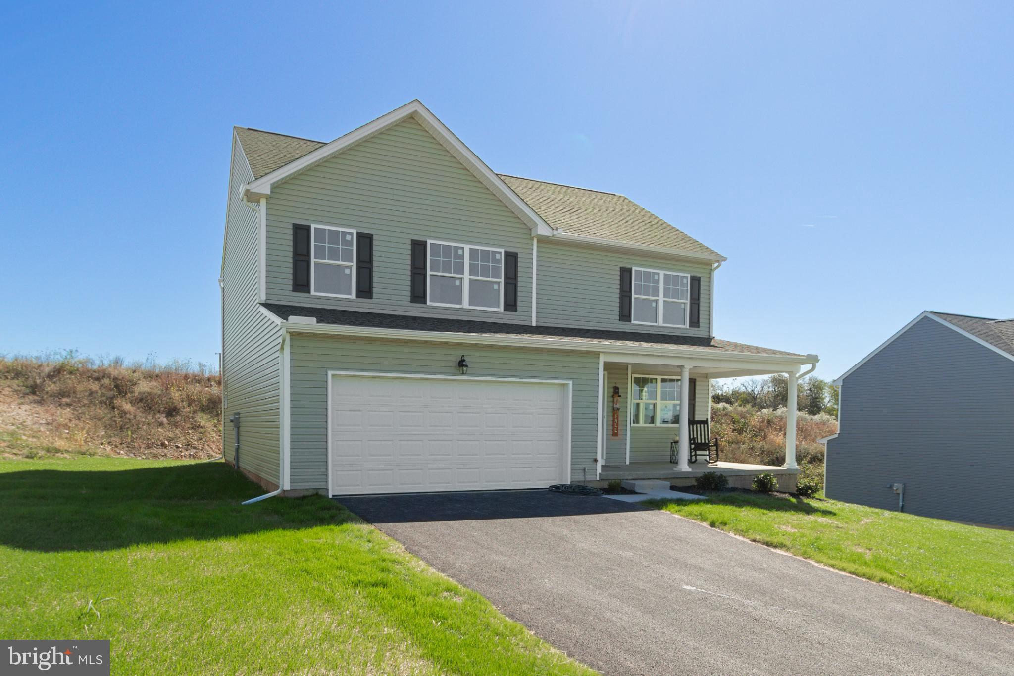 282 Valley View Circle, Unit 141 York, PA 17408 - Photo 1 of 43 a front view of a house with a yard and garage