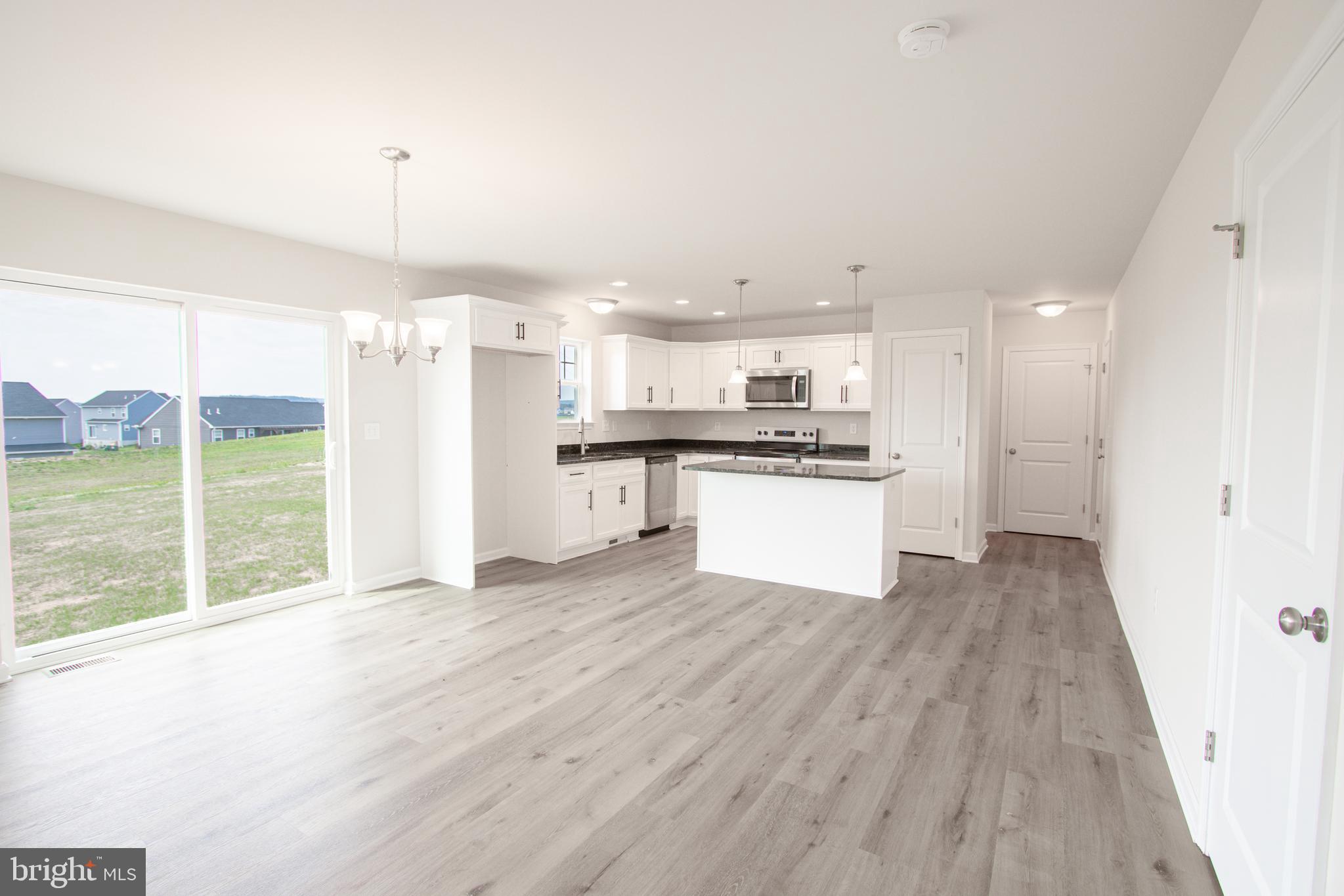 282 Valley View Circle, Unit 141 York, PA 17408 - Photo 13 of 43 a view of kitchen with wooden floor and window