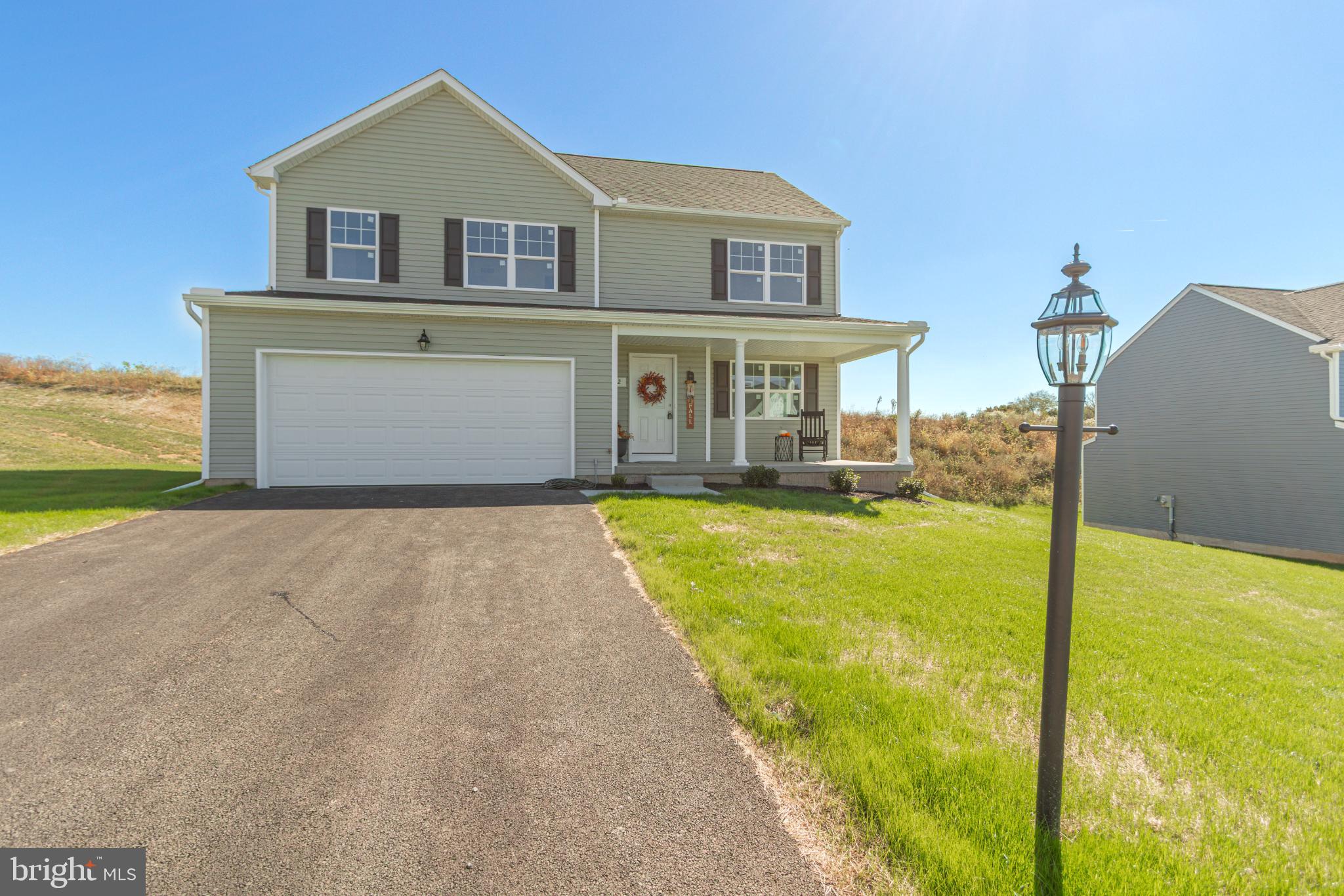 282 Valley View Circle, Unit 141 York, PA 17408 - Photo 2 of 43 a front view of a house with a yard
