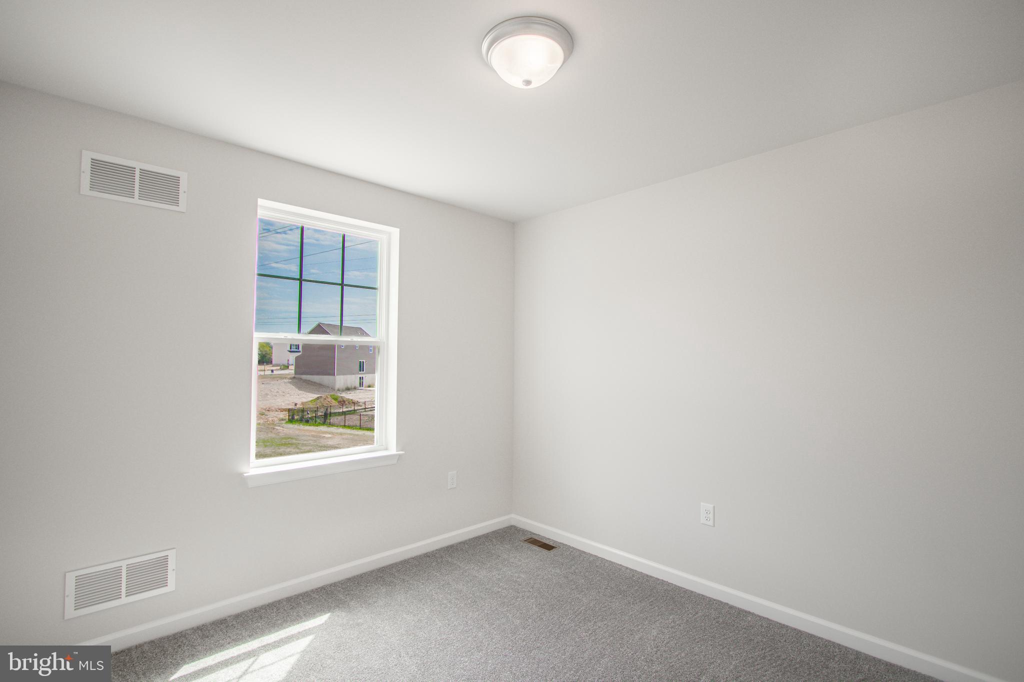 282 Valley View Circle, Unit 141 York, PA 17408 - Photo 26 of 43 an empty room with windows