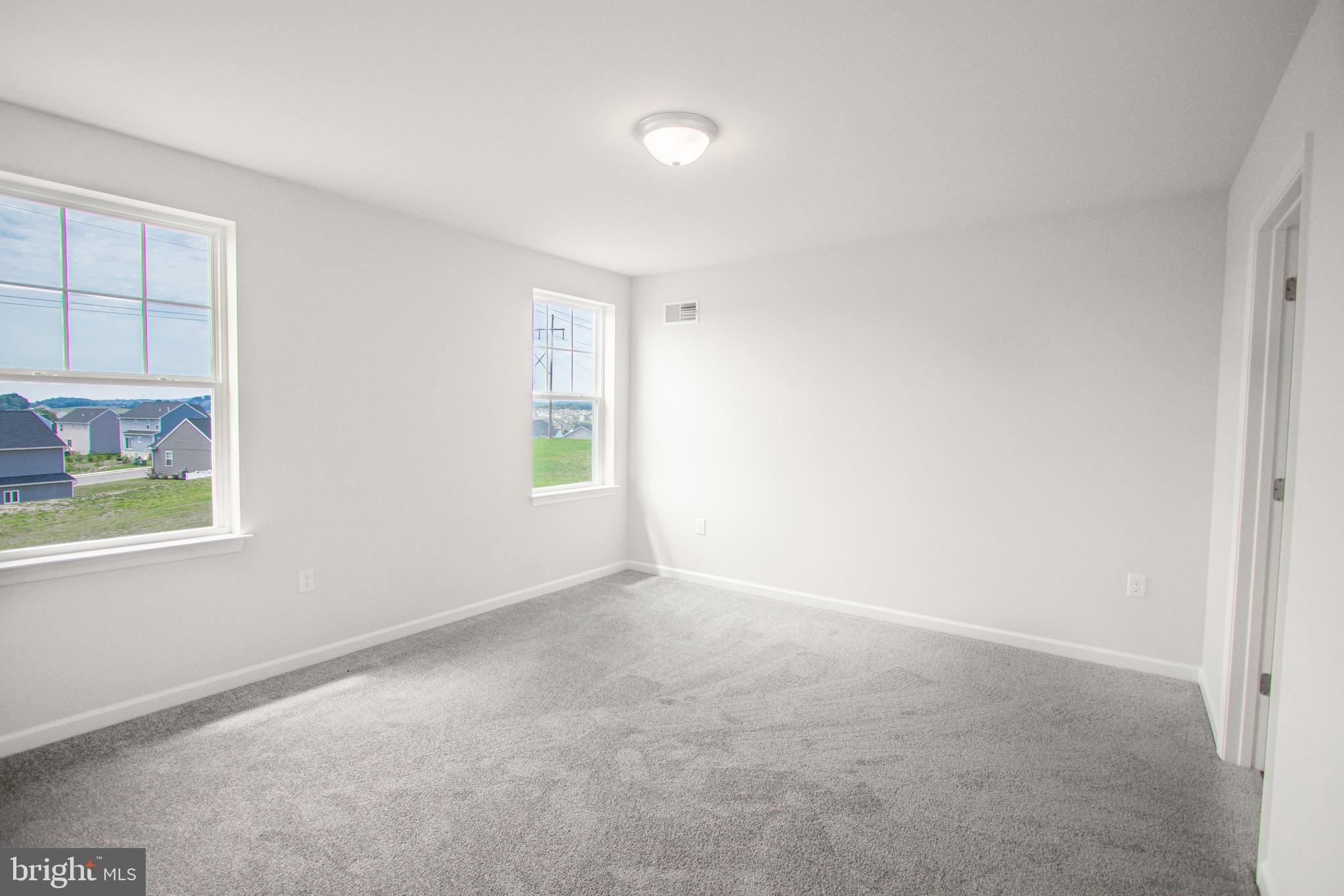 282 Valley View Circle, Unit 141 York, PA 17408 - Photo 35 of 43 an empty room with windows