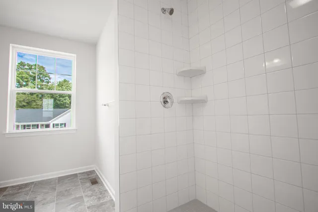 a view of an empty room with stairs