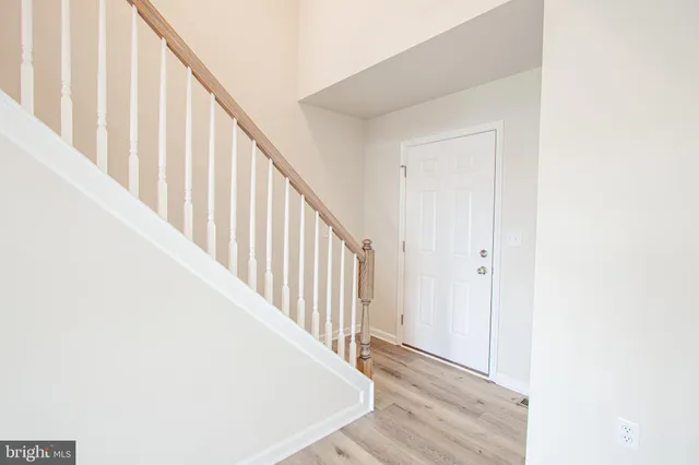 a view of a hallway with staircase