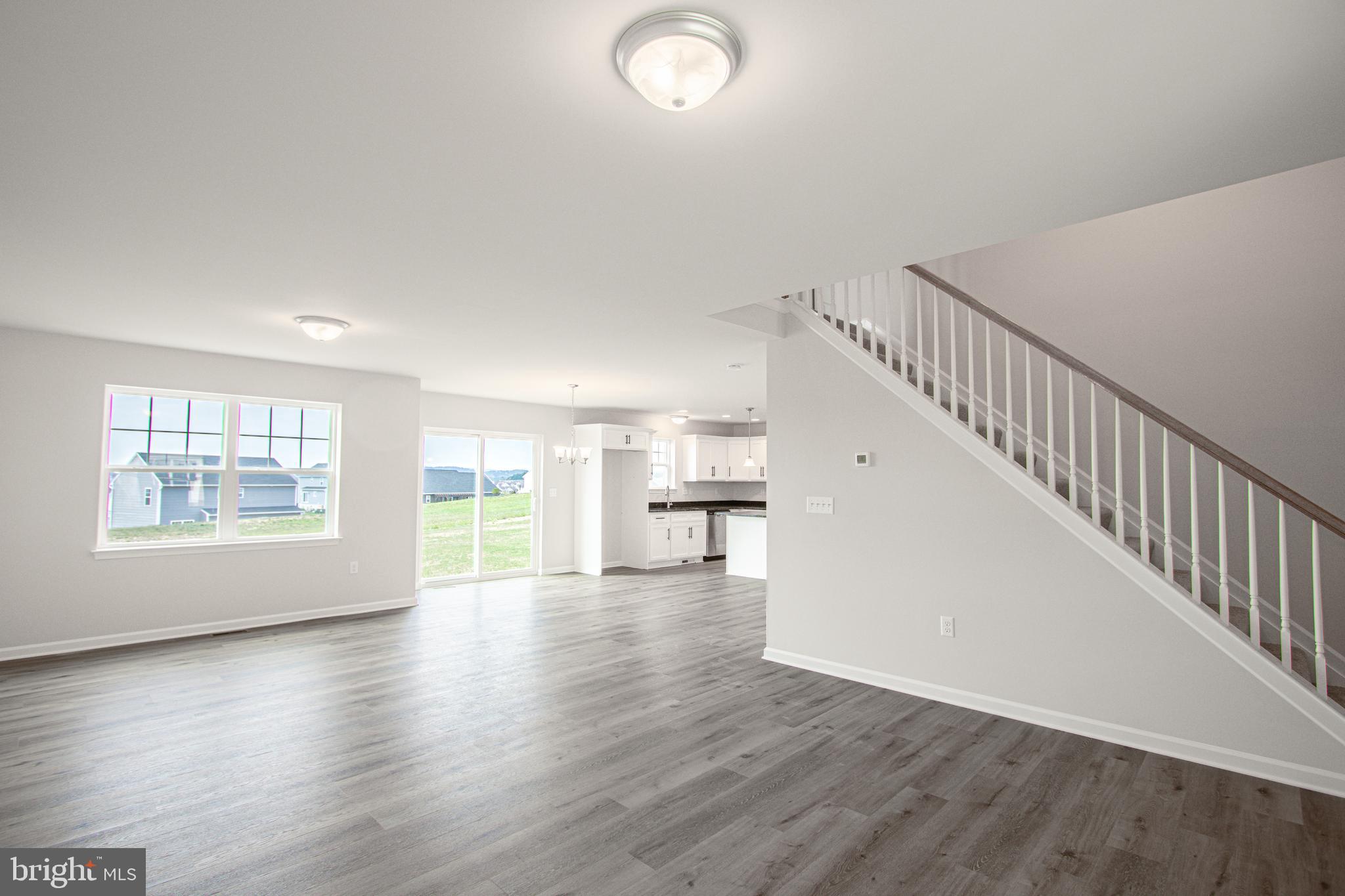 282 Valley View Circle, Unit 141 York, PA 17408 - Photo 8 of 43 a view of empty room with wooden floor and fan