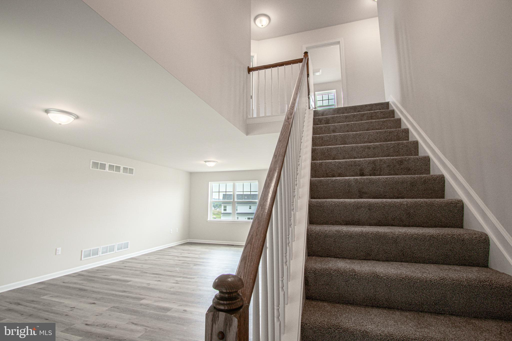 282 Valley View Circle, Unit 141 York, PA 17408 - Photo 9 of 43 a view of entryway and hall with wooden floor
