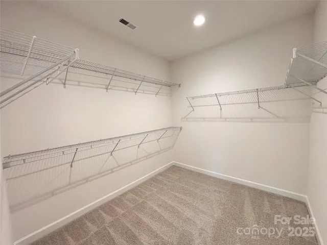 a view of a room with racks on the wall