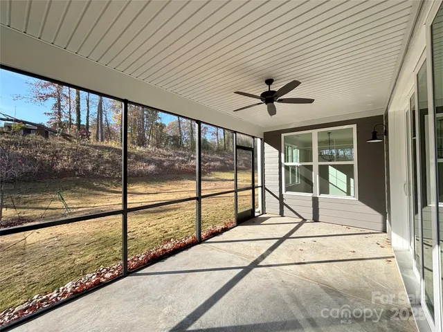 a view of a balcony with a ceiling fan