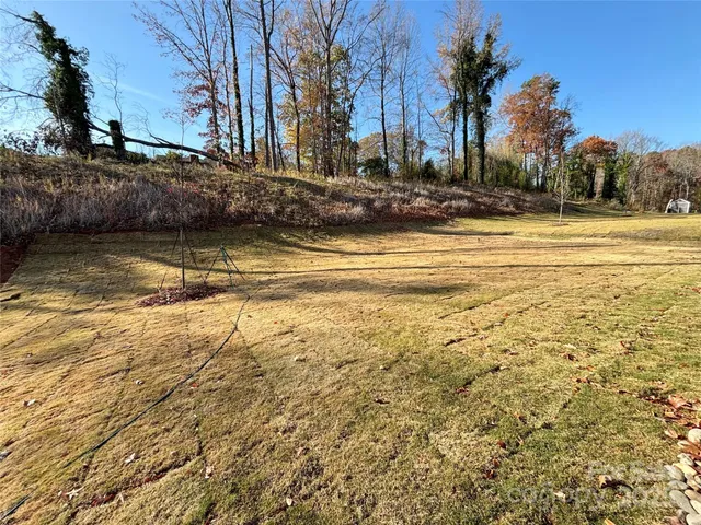 a view of swimming pool with outdoor seating