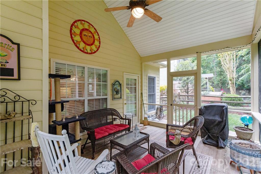 7401 Reedy Creek Road, Unit 24 Charlotte, NC 28215 - Photo 28 of 31 a living room with furniture and a large window