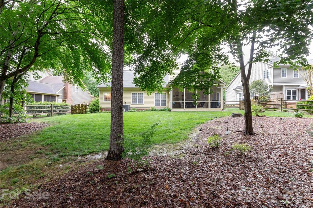 7401 Reedy Creek Road, Unit 24 Charlotte, NC 28215 - Photo 30 of 31 a view of a house with backyard and a tree