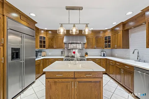 a kitchen with a sink and refrigerator