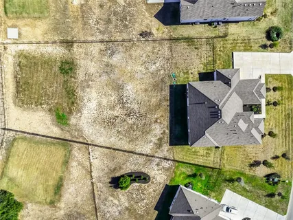 a balcony with table and chairs
