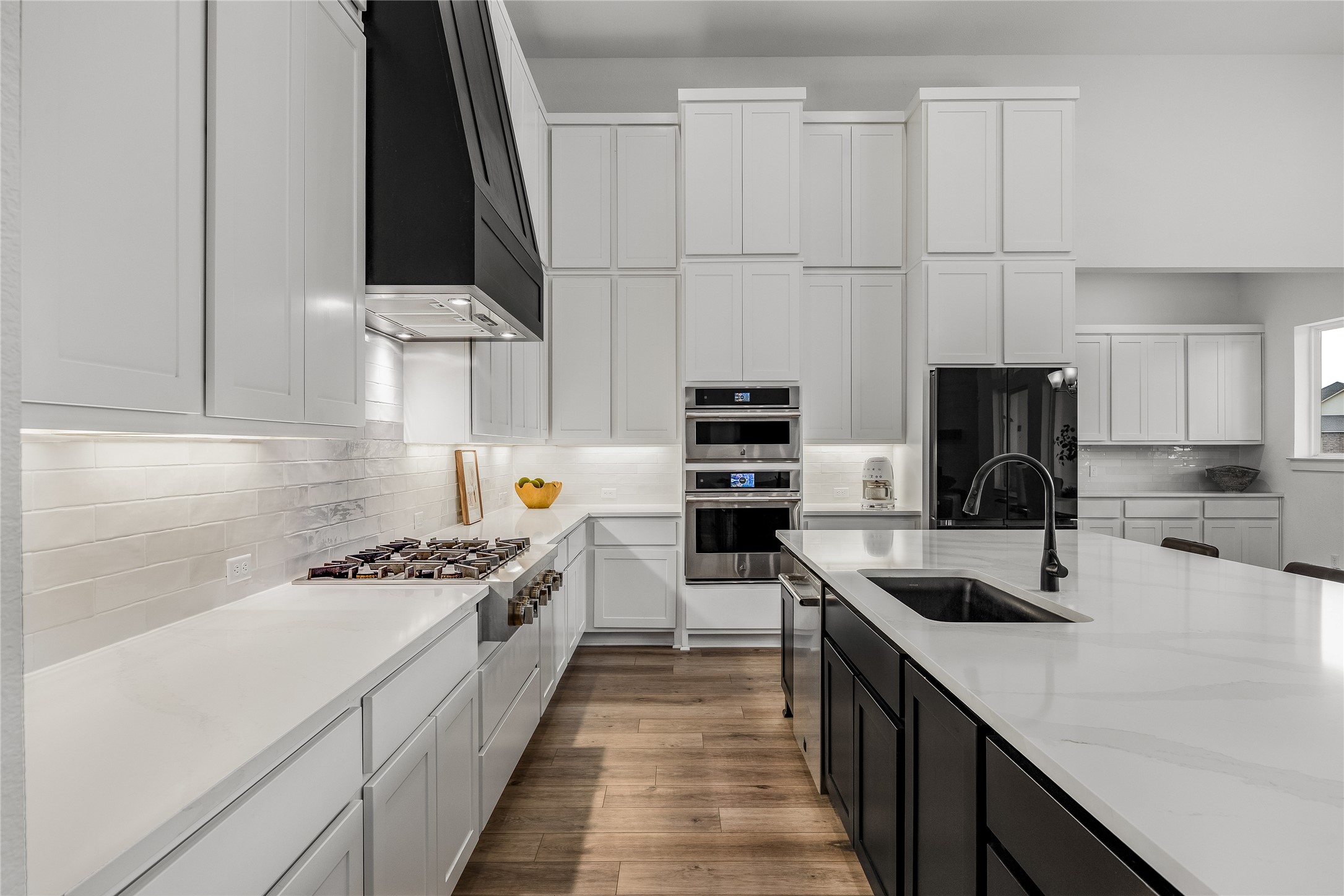 494 Prairie Clover Drive Dripping Springs, TX 78620 - Photo 9 of 39 Quartz Counter Top with Under Cabinet Lighting and Ceiling High Cabinets.