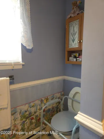 a bathroom with a toilet