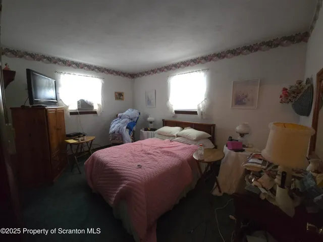 a bed room with a bed furniture and a window