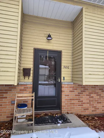 a front view of a house with stairs