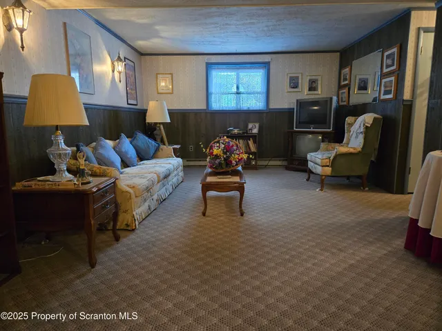 a living room with furniture and a lamp