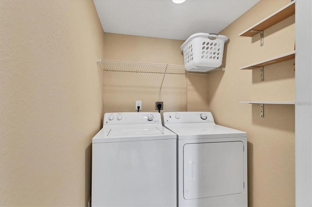 8776 Midnight Pass Road, Unit C307 Sarasota, FL 34242 - Photo 20 of 45 a utility room with dryer and washer