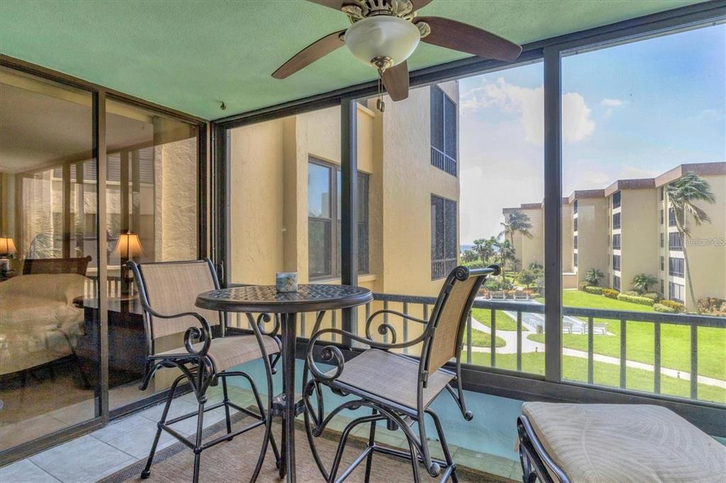 8776 Midnight Pass Road, Unit C307 Sarasota, FL 34242 - Photo 22 of 45 a view of a room with furniture and floor to ceiling windows