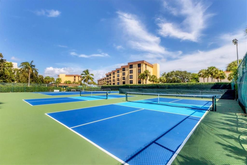 8776 Midnight Pass Road, Unit C307 Sarasota, FL 34242 - Photo 32 of 45 a view of a tennis court