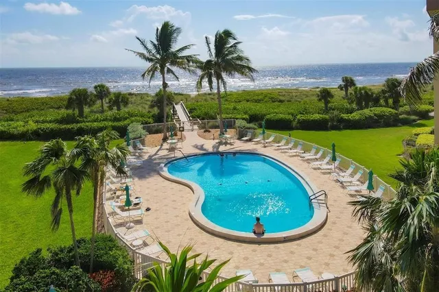 a view of a swimming pool with a garden