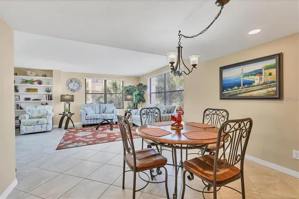 a dining room with furniture and window