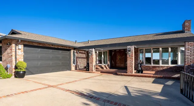 a view of a backyard with sitting area