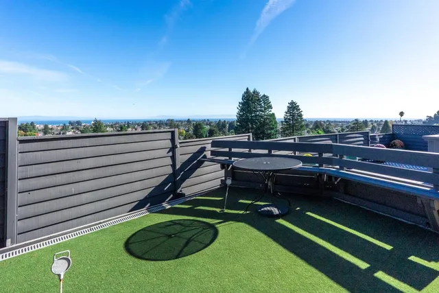 an aerial view of a city with ocean view
