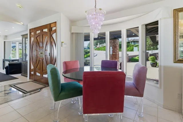 a living room with a fireplace furniture and a large window