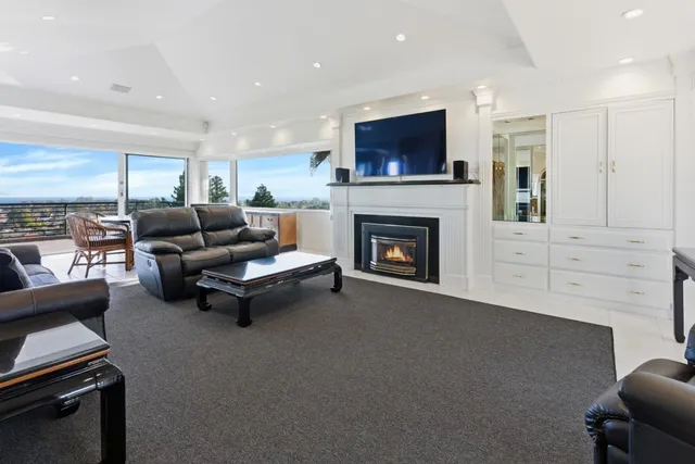 a kitchen with stainless steel appliances granite countertop a sink and a refrigerator