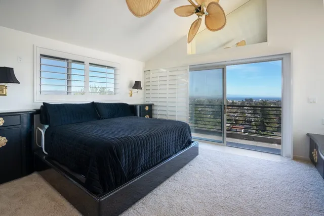 a large tub sitting in a bathroom next to a window